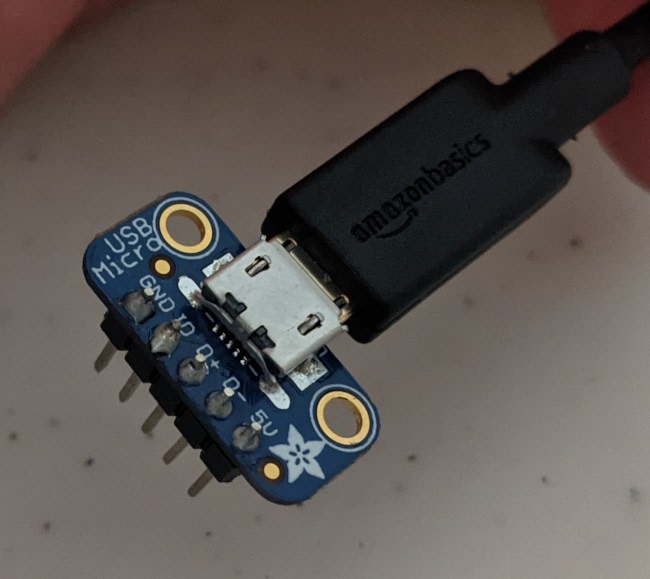 The micro USB breakout with soldered on headers. Note the
   medicore soldering :)