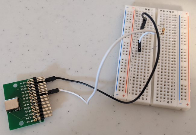 The USB-C breakout board with the pull down resistor (not
   actually) connected on the bread board